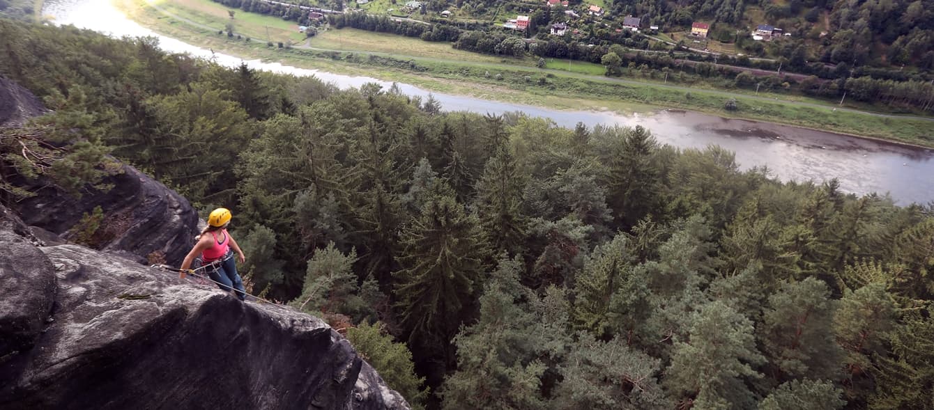 Climber on a sandstone tower above the Elbe river – Elbe Valley sandstone, Rockbusters Europe trip