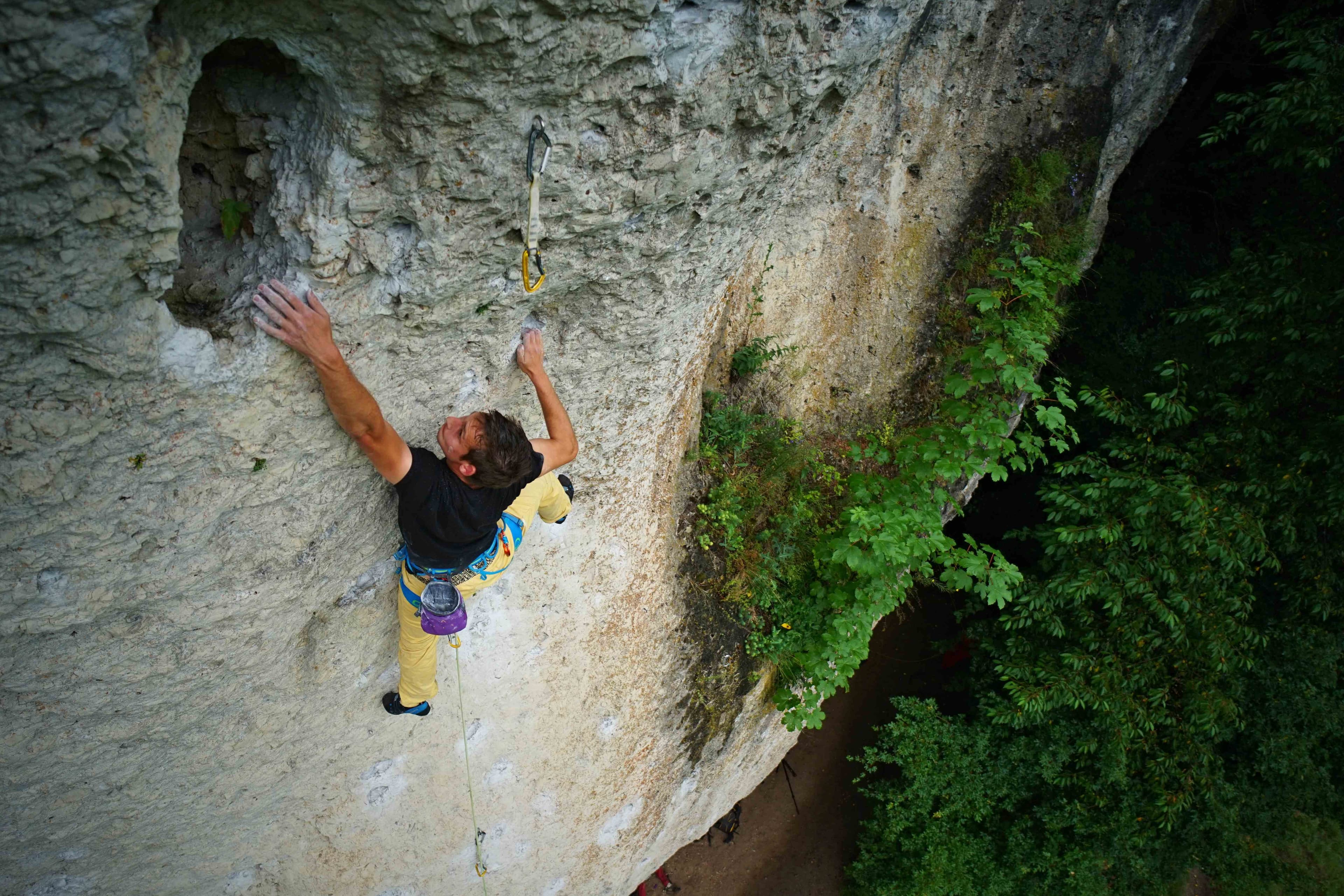 Matej climbing Ejaculacion (UIAA 8) in Frankenjura, Germany – Rockbusters Europe rock trip interview