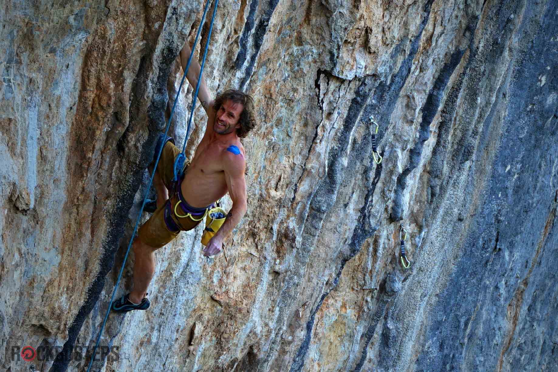 Patxi Usobiaga climbing an 8b+ on blue-streaked limestone in Catalonia, Spain – Rockbusters coach